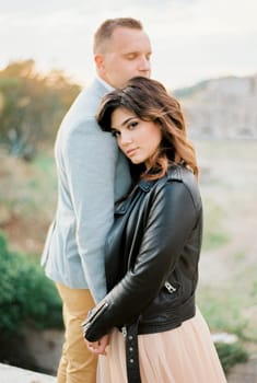Bride leaning her head on the groom shoulder. Close-up. High quality photo