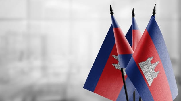 A small Cambodia flag on an abstract blurry background.