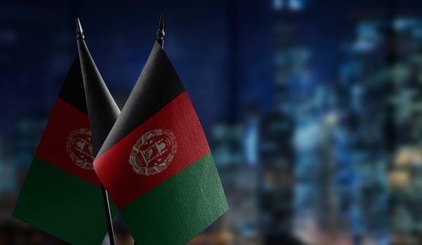 A small Afghanistan flag on an abstract blurry background.
