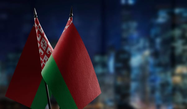 A small Belarus flag on an abstract blurry background.