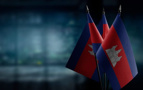 A small Cambodia flag on an abstract blurry background.