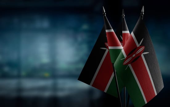 Small flags of the Kenya on an abstract blurry background.