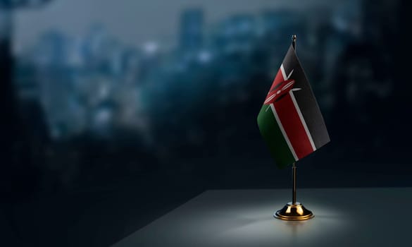 Small flags of the Kenya on an abstract blurry background.