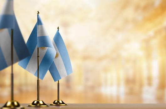 A small Argentina flag on an abstract blurry background.