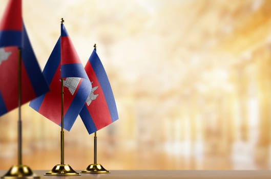 A small Cambodia flag on an abstract blurry background.