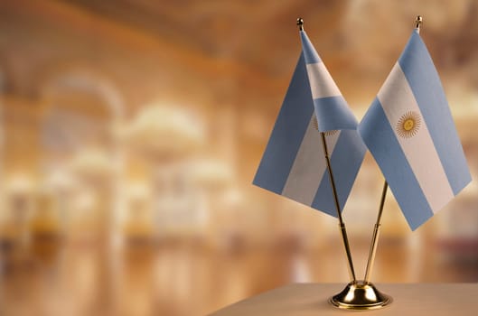 A small Argentina flag on an abstract blurry background.