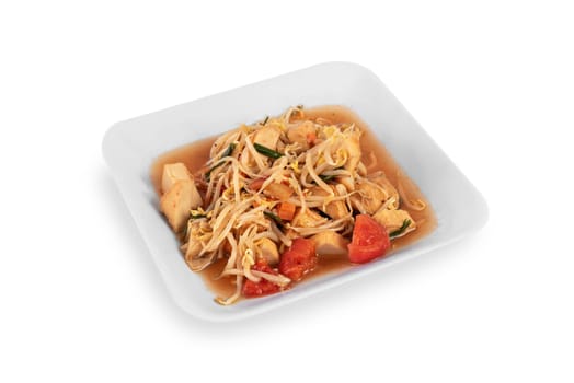 stir fried tofu with vegetables and bean sprout on dish over white background