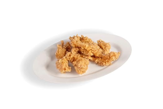 deep fried chicken  on dish over white background