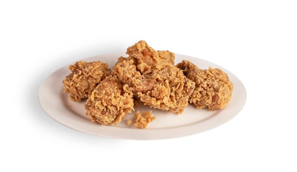 deep fried chicken  on dish over white background