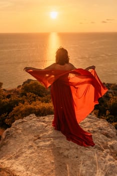 Woman in red dress, fashion model in evening dress, soaring in the street, sunset.