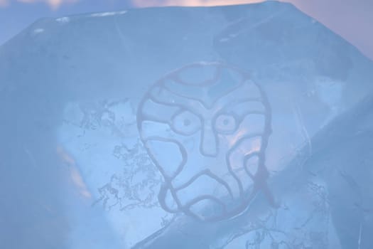 A shaman's mask painted on an ice floe on Lake Baikal on Olkhon Island