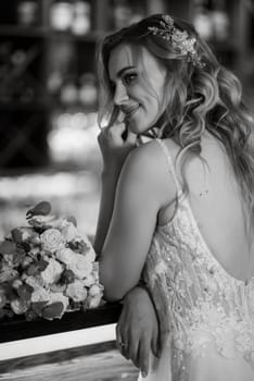 bride inside the cocktail bar at the bar in a bright atmosphere