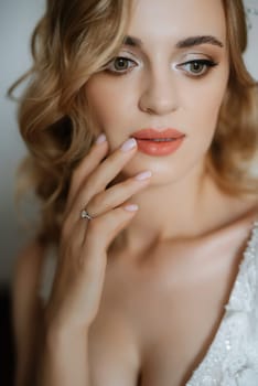 morning of the bride with the creation of the image of makeup and the creation of hairstyles