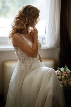 morning of the bride with the creation of the image of makeup and the creation of hairstyles