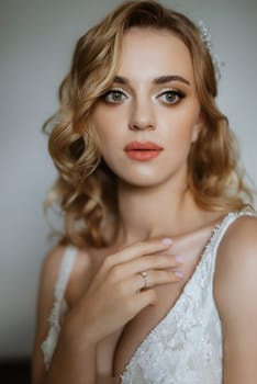 morning of the bride with the creation of the image of makeup and the creation of hairstyles