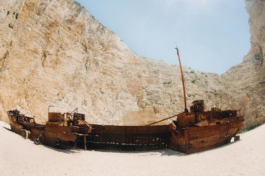 curved ship on Zakynthos island, Greece Navagio beach, or shipwreck beach,sometimes called smugglers ' Bay , on the coast of Zakynthos island, in the Ionian Islands of Greece