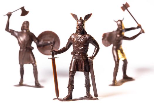 Vintage toy Brown Viking soldiers isolated on white background.