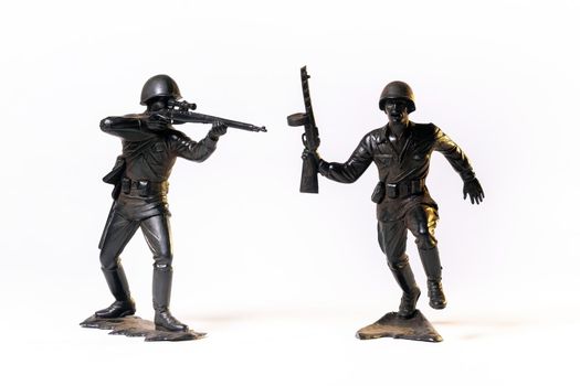 Vintage toy black soldiers isolated on white background.
