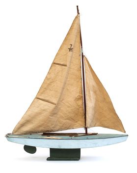 Scale model of old sailboat on white background
