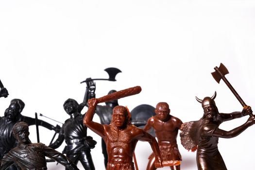 A set of different toy figures of soldiers on a white background.