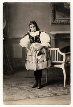 THE CZECHOSLOVAK REPUBLIC, CIRCA 1930s: Vintage portrait photo shows girl in folk costum. Photo studio portrait, circa 1930s.