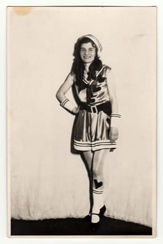 THE CZECHOSLOVAK REPUBLIC, CIRCA 1930s: Vintage portrait photo shows young girl in a retro carnival costum (marine costum). Photo studio portrait, circa 1930s.