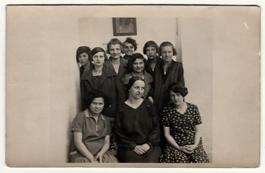 HODONIN, THE CZECHOSLOVAK REPUBLIC, 1927: Vintage photo shows a group of girls (classmates) in school hallway with tutor, 1927 in Hodonin.