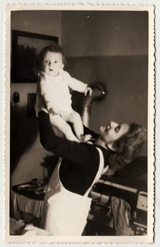 THE CZECHOSLOVAK REPUBLIC, CIRCA 1941: Vintage photo shows a small girl with her mother, circa 1941.