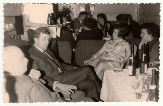 THE CZECHOSLOVAK SOCIALIST REPUBLIC, 1960: Vintage photo shows a group of people in a restaurant, 1960s.