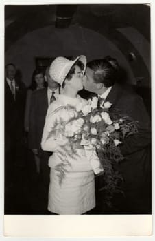 THE CZECHOSLOVAK SOCIALIST REPUBLIC, CIRCA 1970: A vintage photo shows wedding photo - bridal kiss, circa 1970.