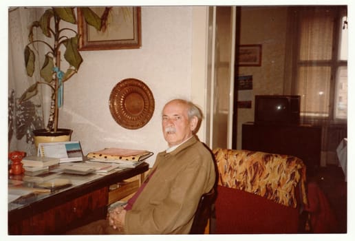 THE CZECHOSLOVAK SOCIALIST REPUBLIC, CIRCA 1980s: Vintage photo shows man sits on chair, circa 1980s.