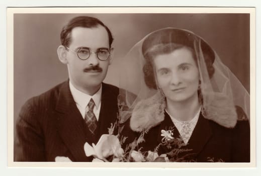 THE CZECHOSLOVAK REPUBLIC, CIRCA 1935: A vintage photo (with colour tint) shows wedding portrait of newly-weds, circa 1935.