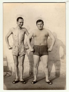 THE CZECHOSLOVAK SOCIALIST REPUBLIC, CIRCA 1965: A vintage photo shows men and their muscular bodies.