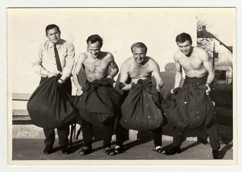 THE CZECHOSLOVAK SOCIALIST REPUBLIC, CIRCA 1965: A vintage photo shows soldiers look forward to going out of the Army.