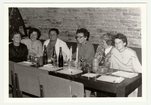 THE CZECHOSLOVAK SOCIALIST REPUBLIC, 1985: Vintage photo shows a group of people in a wine bar.