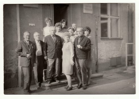 THE CZECHOSLOVAK SOCIALIST REPUBLIC, CIRCA 1970s: Vintage photo shows group of people in front of building.