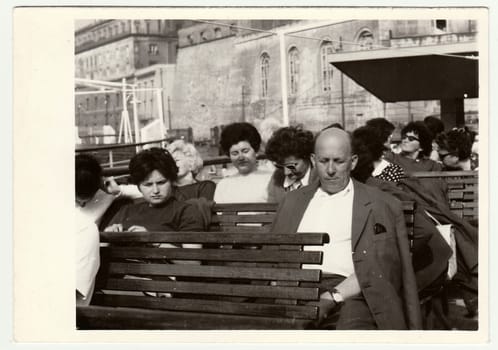 NAPLES, ITALY - MAY, 1969: Vintage photo shows people on vacation.