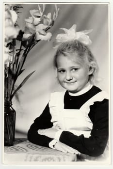 USSR - CIRCA 1975: Vintage portrait of schoolgirl with ribbon on hair.