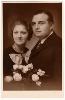 PRAGUE, THE CZECHOSLOVAK REPUBLIC - NOVEMBER 17, 1934: Vintage photo shows marrital couple.