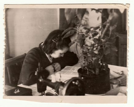 USSR - CIRCA 1970s: Vintage photo shows girl reads the book.