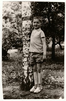 USSR - CIRCA 1970s: Vintage photo of a young boy (about 13 years old) in nature.