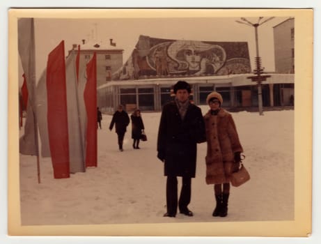 USSR - CIRCA 1980s: Vintage photo shows a couple poses on street in winter.