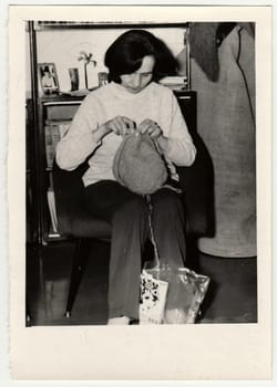 USSR - CIRCA 1970s: Vintage photo shows woman knitting a cap.