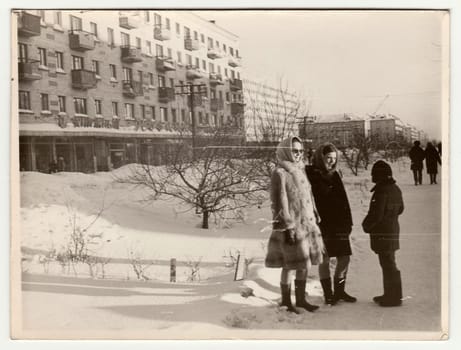 USSR - CIRCA 1980s: Vintage photo shows girls and boy talk on street in winter.