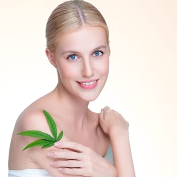 Closeup personable beautiful woman with soft make up and flawless smooth clean skin holding green leaf. Cannabis skincare cosmetic product for natural skin treatment concept in isolated background