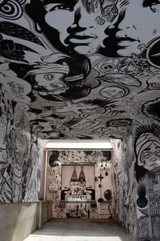 Creative black and white graffiti street art mural lining the streets of Montreal, city of Quebec, Canada