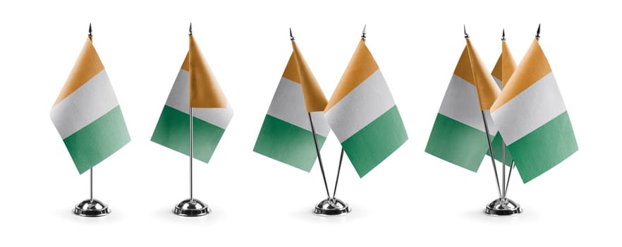 Small national flags of the Cote dIvoire on a white background.