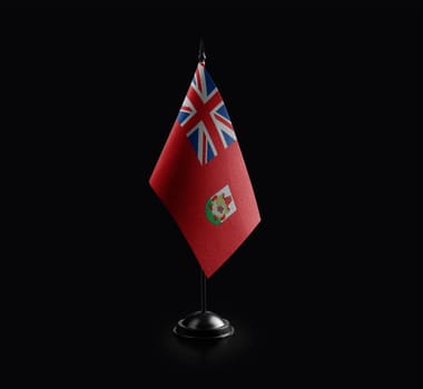 Small national flag of the Bermuda on a black background.
