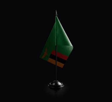 Small national flag of the Zambia on a black background.