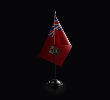 Small national flag of the Bermuda on a black background.